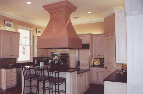 Faux painted vent hood and antiqued cabinets