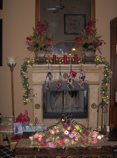 Color washed fireplace mantle decorated for Christmas with decorative dry-brushed medallions added
