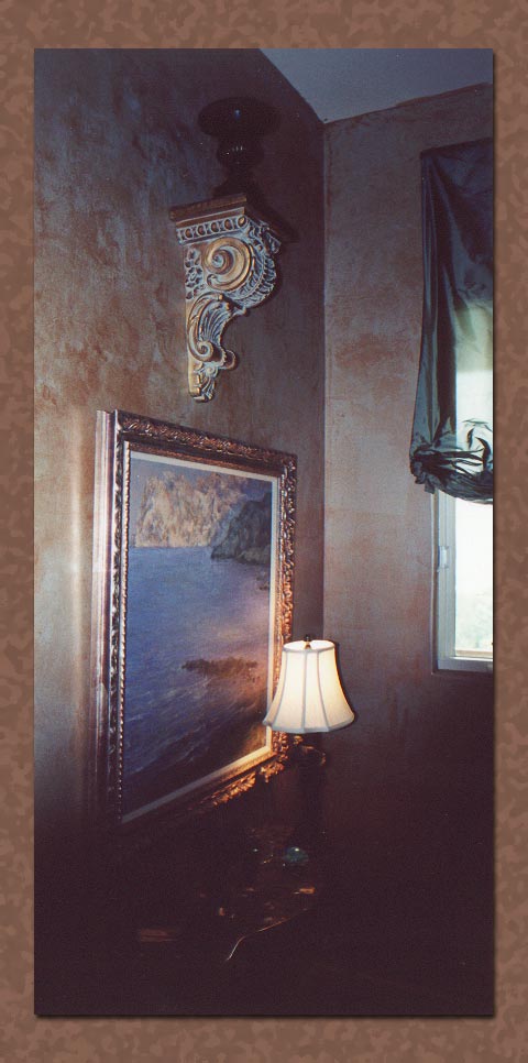 Frottage faux painting detail with guilded sconce and fine art painting
