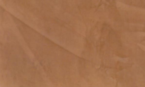 Close-up of a Venetian Plaster faux finish in a Behr color called Marsala.
